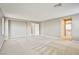 Large primary bedroom with neutral carpet and ensuite bath at 9271 Martel Ave, Las Vegas, NV 89148
