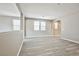 Bonus room features gray-toned wood floors and multiple windows for lots of natural light at 9271 Martel Ave, Las Vegas, NV 89148