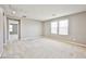 Bonus room with carpeting, neutral walls and two large windows providing ample natural light at 9271 Martel Ave, Las Vegas, NV 89148