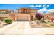 Inviting two-story home with a well-maintained front yard and attached two-car garage at 9271 Martel Ave, Las Vegas, NV 89148