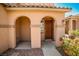 Charming front porch with covered entrance, pillars, and desert landscaping, perfect for welcoming guests at 9271 Martel Ave, Las Vegas, NV 89148