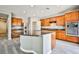 Spacious kitchen with an island, stainless steel appliances, and granite countertops at 9271 Martel Ave, Las Vegas, NV 89148