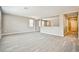 Spacious living room with wood floors and large windows for natural light at 9271 Martel Ave, Las Vegas, NV 89148