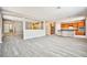 Open-concept living area with hardwood flooring and a view of the kitchen at 9271 Martel Ave, Las Vegas, NV 89148