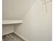 Attic storage space with shelving and wood-look floors at 9271 Martel Ave, Las Vegas, NV 89148