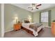 Well-lit bedroom with a ceiling fan, carpeted floors, and neutral décor at 10001 Peace Way # 1250, Las Vegas, NV 89147