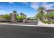 Inviting community entrance with lush landscaping and well-maintained signage, creating a welcoming first impression at 10001 Peace Way # 1250, Las Vegas, NV 89147
