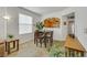 Bright dining area featuring a wooden table set and easy access to an open kitchen at 10001 Peace Way # 1250, Las Vegas, NV 89147