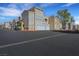 Well-maintained apartment complex featuring garages and appealing architectural details in a desirable residential area at 10001 Peace Way # 1250, Las Vegas, NV 89147