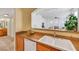 Kitchen boasts granite countertops, stainless steel appliances, and a view to the living room at 10001 Peace Way # 1250, Las Vegas, NV 89147