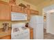 Galley kitchen showcasing stainless appliances, granite countertops, and overhead cabinet storage at 10001 Peace Way # 1250, Las Vegas, NV 89147