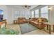 Bright living room features neutral tile flooring and leather sofas with lots of natural light at 10001 Peace Way # 1250, Las Vegas, NV 89147