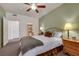 Spacious bedroom with attached bathroom, ceiling fan, and soft, warm colors at 10001 Peace Way # 1250, Las Vegas, NV 89147