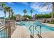 Resort-style pool area with palm trees and comfortable seating, providing a luxurious and relaxing atmosphere at 10001 Peace Way # 1250, Las Vegas, NV 89147