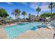 Beautiful pool surrounded by palm trees, offering a refreshing oasis for residents to enjoy on sunny days at 10001 Peace Way # 1250, Las Vegas, NV 89147