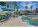 Inviting pool area featuring shaded lounge chairs and a decorative water feature, perfect for relaxation and leisure at 10001 Peace Way # 1250, Las Vegas, NV 89147