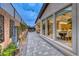 This back patio includes stone flooring, water feature, ivy covered trellis, and access to an outdoor living space at 101 Mirage View Dr, Henderson, NV 89011