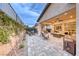 Large backyard patio with pavers, an outdoor kitchen, and lots of space for entertaining at 101 Mirage View Dr, Henderson, NV 89011
