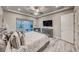 Comfortable bedroom with ample natural light and a view of the landscaped backyard at 101 Mirage View Dr, Henderson, NV 89011