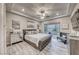 Relaxing main bedroom featuring a luxurious bed, modern furniture, and ample natural light at 101 Mirage View Dr, Henderson, NV 89011