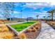 Well-manicured bocce ball court with turf and landscape, offering a social and recreational outdoor amenity at 101 Mirage View Dr, Henderson, NV 89011