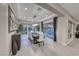 Elegant dining room with modern chandelier and sliding door leading to backyard patio at 101 Mirage View Dr, Henderson, NV 89011