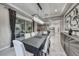 Dining room with modern chandelier and gray and white decor at 101 Mirage View Dr, Henderson, NV 89011