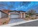 Beautiful single-story home featuring desert landscaping and a paved driveway in a serene neighborhood at 101 Mirage View Dr, Henderson, NV 89011