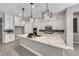 Modern kitchen with stylish pendant lights, a large island, and stainless steel appliances at 101 Mirage View Dr, Henderson, NV 89011
