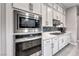 Kitchen featuring stainless steel appliances, modern cabinetry, and tiled backsplash at 101 Mirage View Dr, Henderson, NV 89011