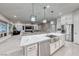 Open-concept kitchen with island, stainless steel appliances, and seamless access to living area at 101 Mirage View Dr, Henderson, NV 89011