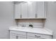 Laundry area features sink, under cabinet storage, upper cabinets and a countertop at 101 Mirage View Dr, Henderson, NV 89011