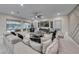 Comfortable living room with a large sofa, media center, and view of the backyard at 101 Mirage View Dr, Henderson, NV 89011