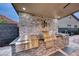 Outdoor kitchen with stone surround, stainless steel grill, and counterspace, great for entertaining at 101 Mirage View Dr, Henderson, NV 89011