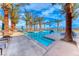 Beautiful pool area surrounded by palm trees and lounge chairs, perfect for relaxation and enjoyment at 101 Mirage View Dr, Henderson, NV 89011