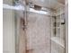 Tiled shower featuring a large shower head and built in seat at 101 Mirage View Dr, Henderson, NV 89011