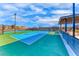 Bright blue tennis courts providing an excellent space for recreation, fitness, and sports activities at 101 Mirage View Dr, Henderson, NV 89011