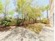 Private backyard featuring a brick patio, mature landscaping, and secure brick fencing at 10469 Mulvaney Cir, Las Vegas, NV 89141