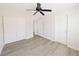 A large bedroom with hardwood floors, double closets and access to an ensuite bathroom at 10469 Mulvaney Cir, Las Vegas, NV 89141