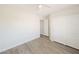 A well lit bedroom featuring hardwood floors and double closet at 10469 Mulvaney Cir, Las Vegas, NV 89141