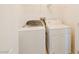 Well-lit laundry room featuring a washer and dryer at 10469 Mulvaney Cir, Las Vegas, NV 89141
