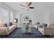 Virtually staged living room showcases light-filled space and calming neutral color palette at 10469 Mulvaney Cir, Las Vegas, NV 89141