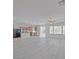 Open-concept living space with wood floors, great natural light and backyard access at 10469 Mulvaney Cir, Las Vegas, NV 89141