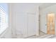 Bedroom featuring a closet with sliding doors and an ensuite bathroom at 10667 Olympic Pine Dr, Las Vegas, NV 89135