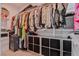 Walk-in closet with shelves and hanging racks for ample storage at 10667 Olympic Pine Dr, Las Vegas, NV 89135