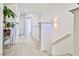 Upstairs hallway featuring light plank flooring and white walls and trim at 10667 Olympic Pine Dr, Las Vegas, NV 89135
