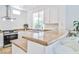 Kitchen with granite countertops, stainless steel appliances, and counter seating at 10667 Olympic Pine Dr, Las Vegas, NV 89135
