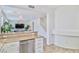 View from kitchen looking into open living area, with granite countertops at 10667 Olympic Pine Dr, Las Vegas, NV 89135