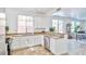 Bright kitchen featuring granite countertops, stainless steel dishwasher, and views to living space at 10667 Olympic Pine Dr, Las Vegas, NV 89135