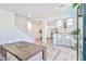 Open living space with access to the kitchen and stairway at 10667 Olympic Pine Dr, Las Vegas, NV 89135